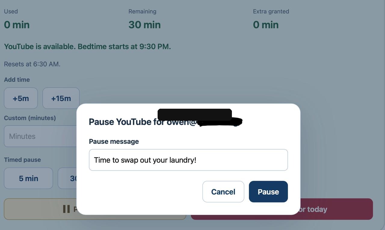 A YouTube pause dialog with the message Time to swap out your laundry. The account address is redacted.